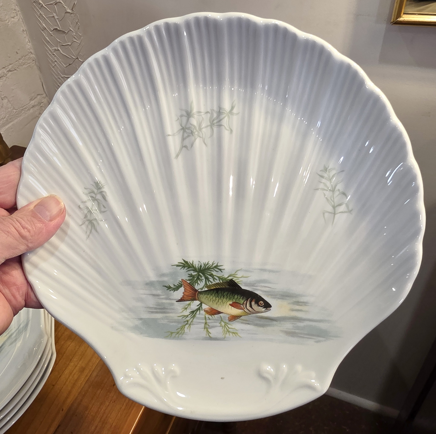 A set of 12 Limoges Fish Plates